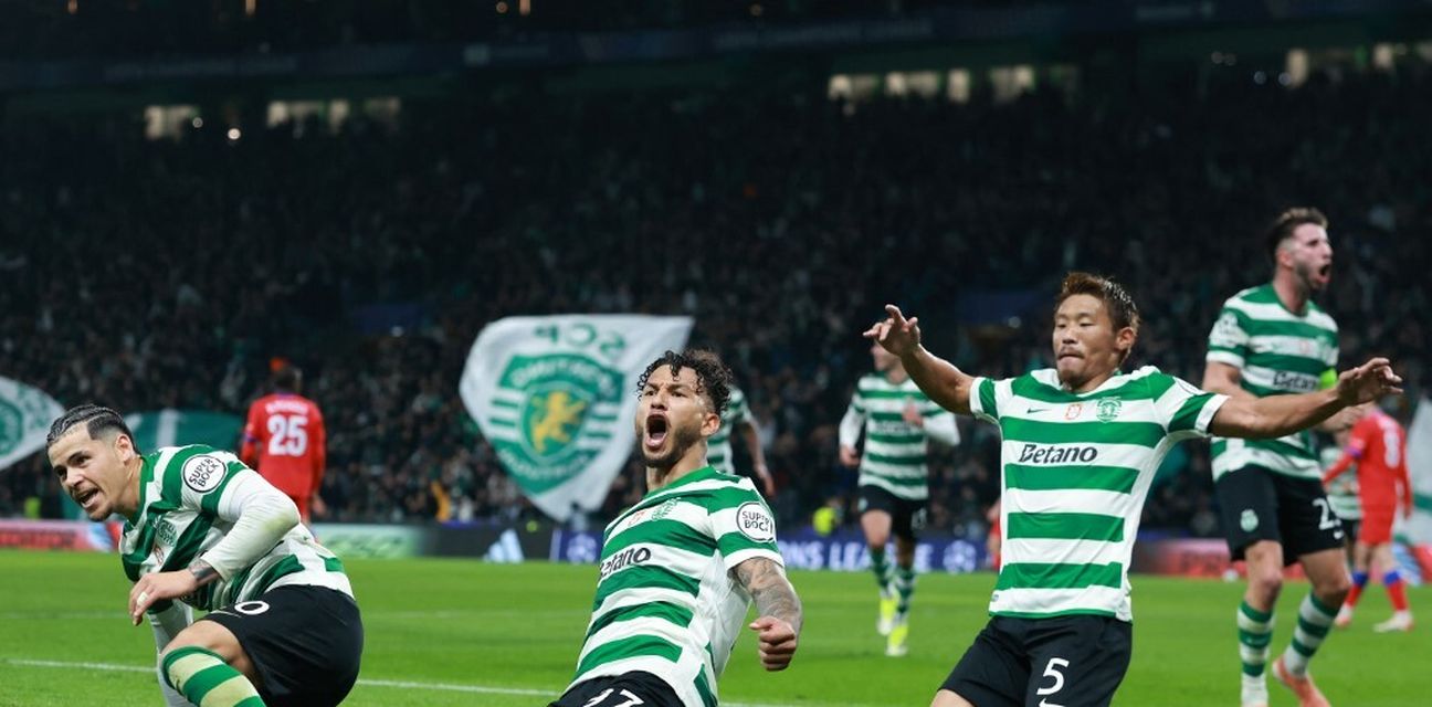 Sporting Lisbon players celebrate after scoring against PSG