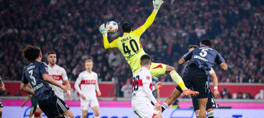 Eintracht goalkeeper Kaua Santos jumping for a high ball