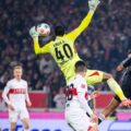 Eintracht goalkeeper Kaua Santos jumping for a high ball