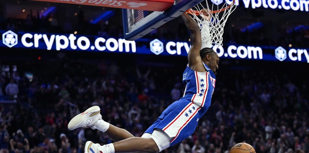Tyrese Maxey dunking the ball