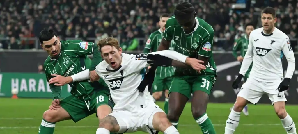 Werder Bremen and Hoffenheim players in a battle for the ball