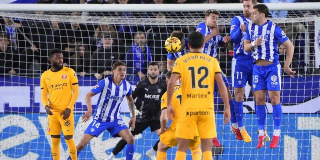 Girona player taking a free kick against Alaves