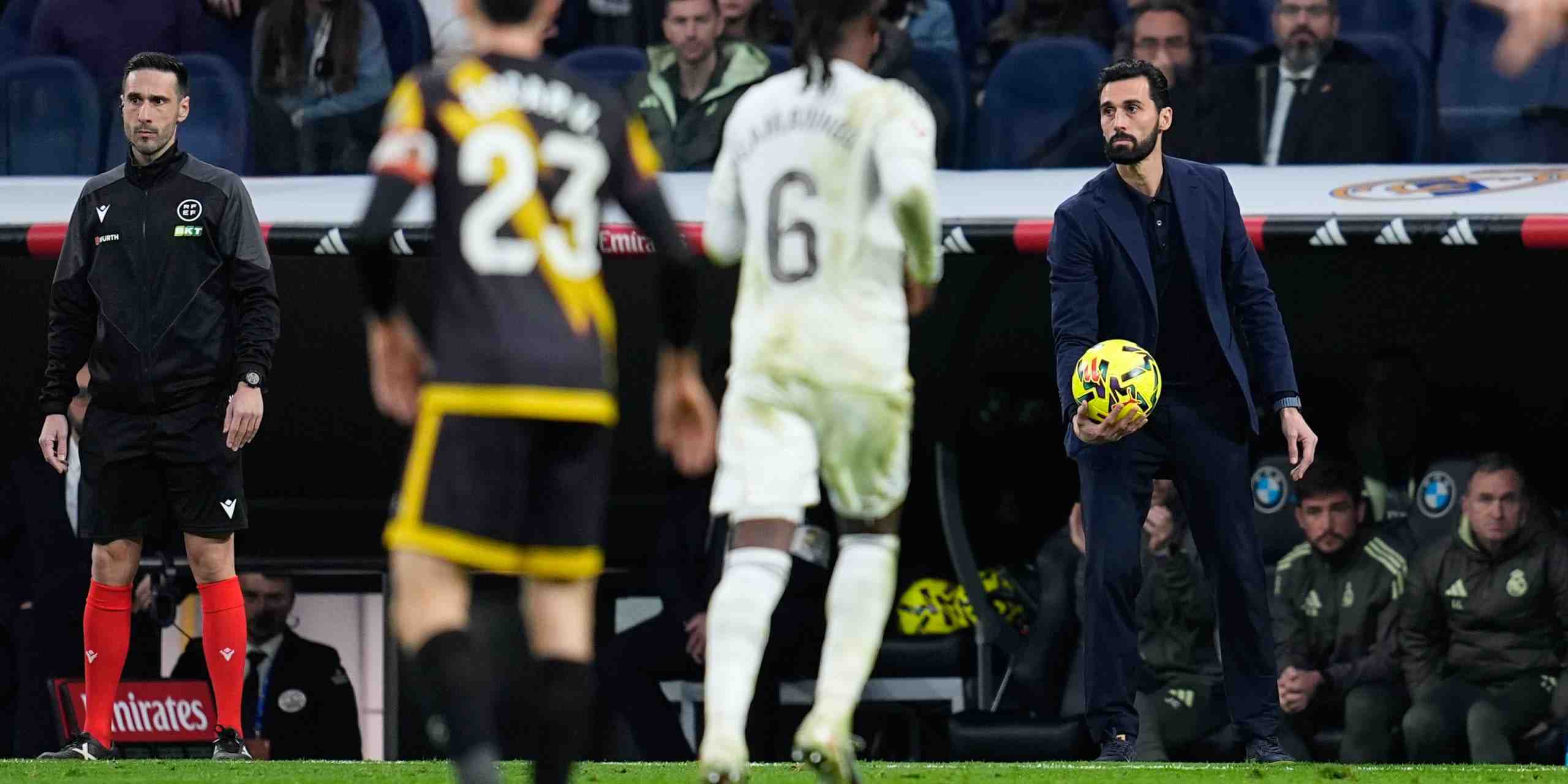 Real Madrid head coach Alvaro Arbeola holding a ball