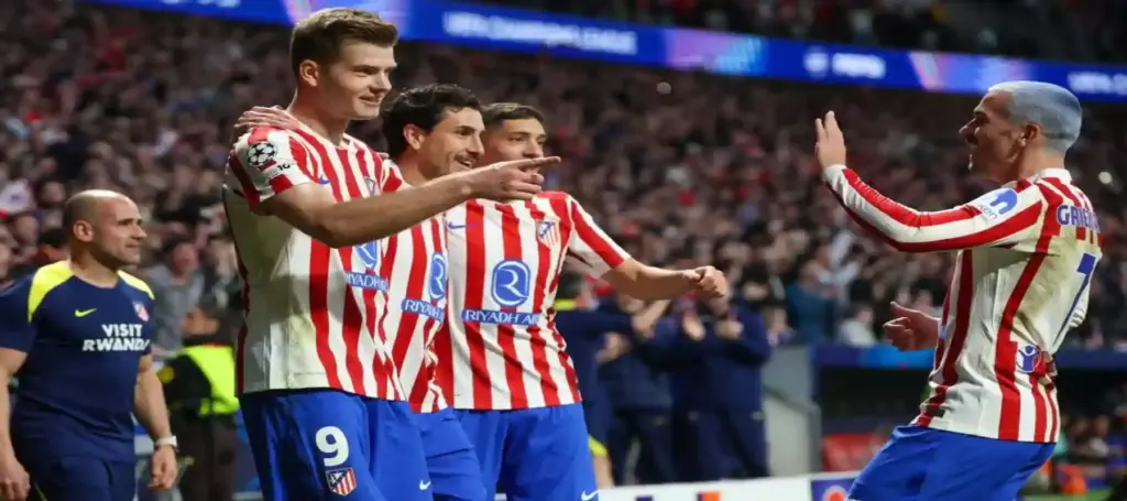 Atletico Madrid players celebrate after scoring against Club Brugge