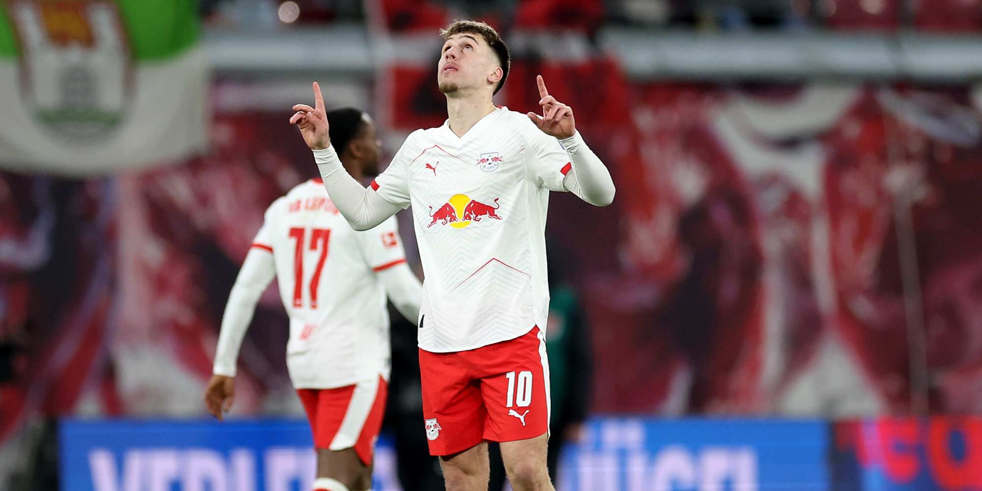 Brajan Gruda pointing to the sky after scoring late equaliser for RB Leipzig against Wolfsburg