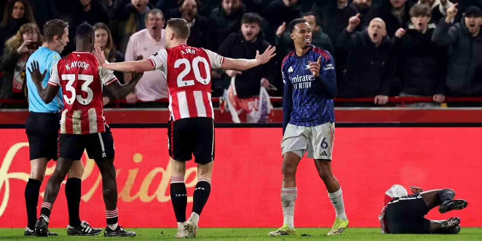 Brentford and Arsenal players talking to the referee
