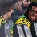 Carney Chukwuemeka smiling from Borussia Dortmund's bench