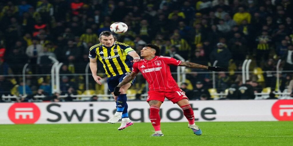 Fenerbahce player outjumping Igor Jesus for a high ball