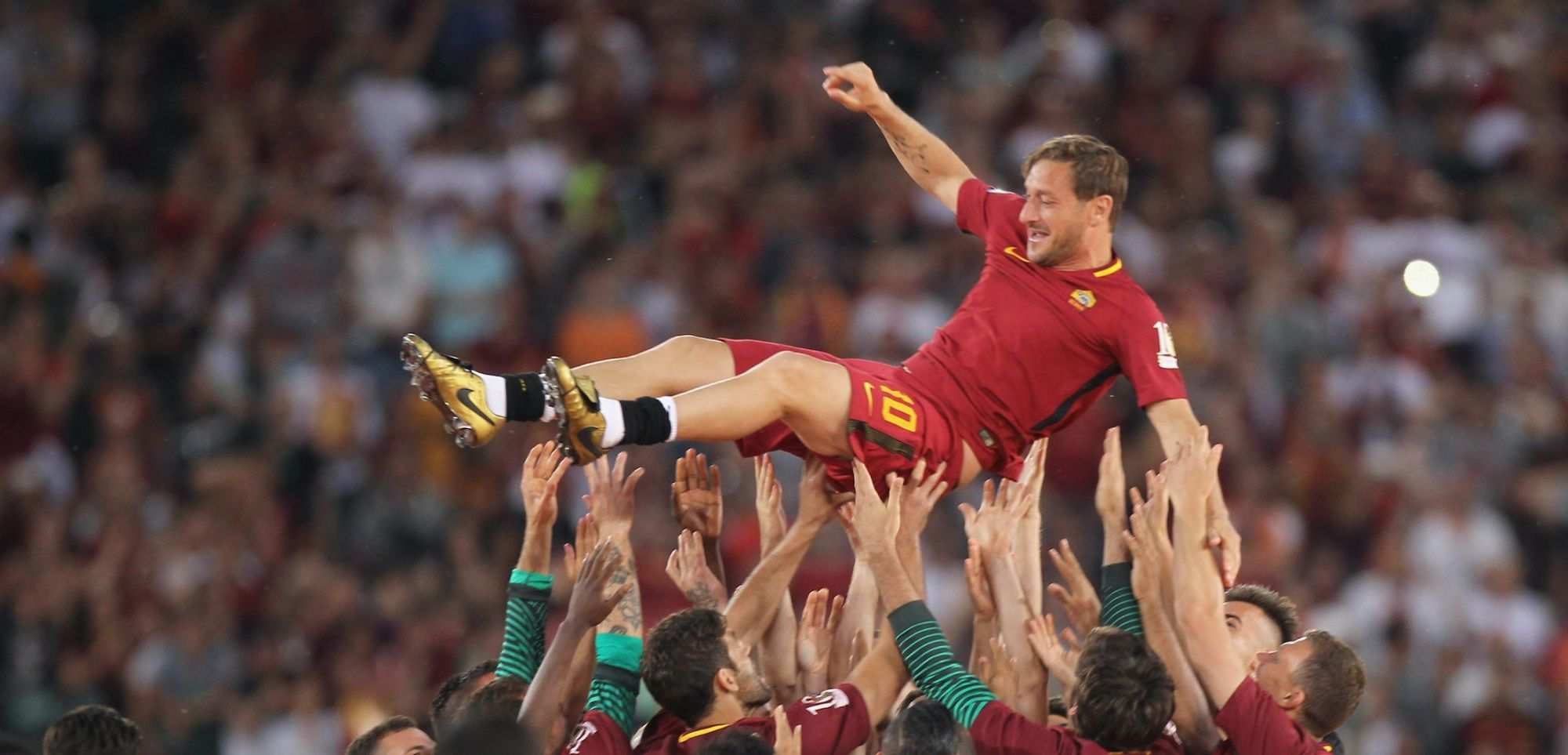 Francesco Totti lifted in the air by Roma teammates