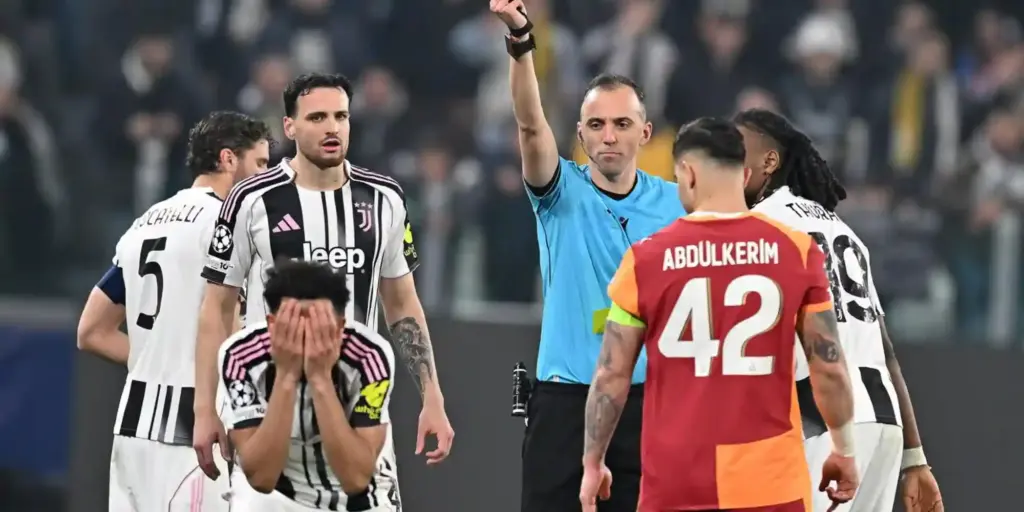 Lloyd Kelly holding his head after being shown red card