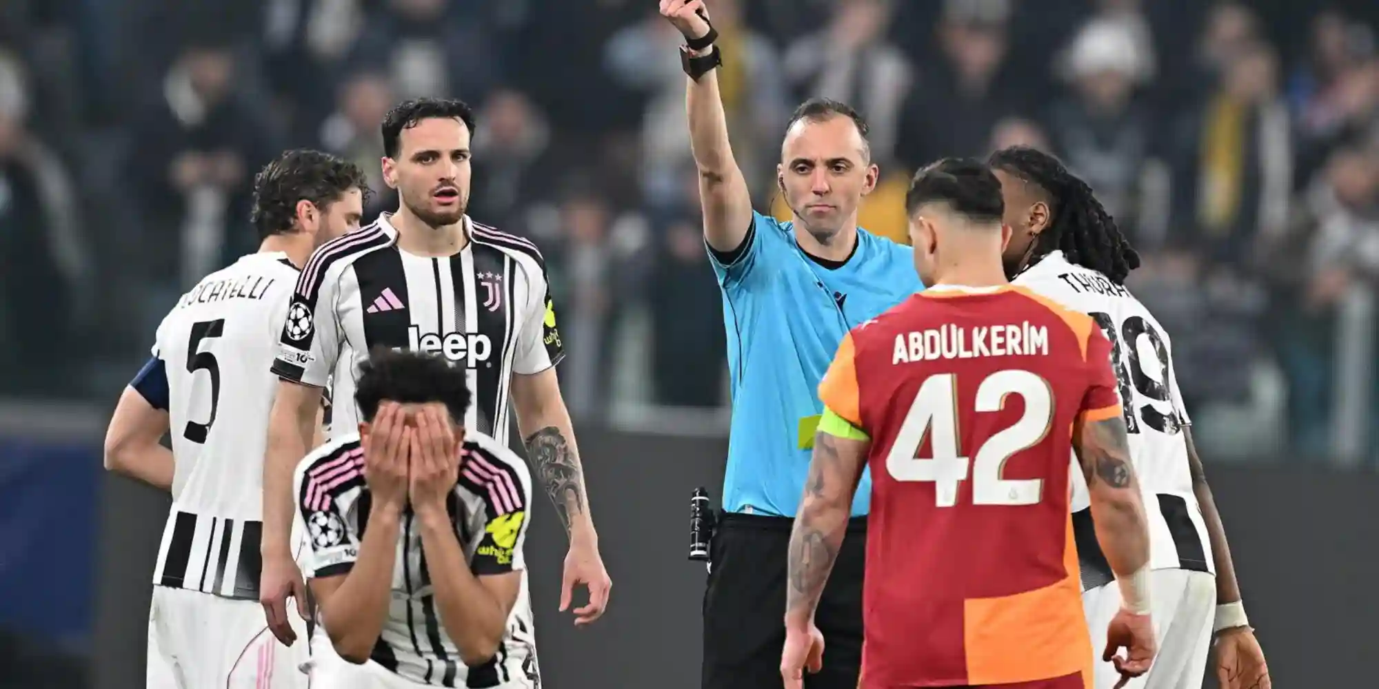 Lloyd Kelly holding his head after being shown red card