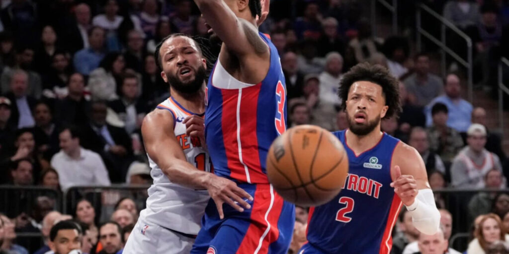 Jalen Brunson stopped by a Detroit Pistons player