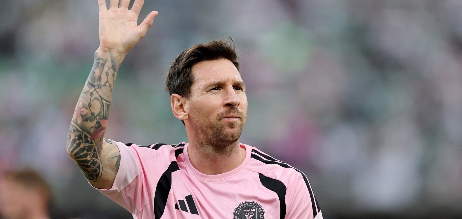 Lionel Messi waving at fans