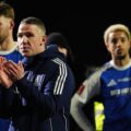 Macclesfield players and manager applaud the fans after losing to Brentford in FA Cup