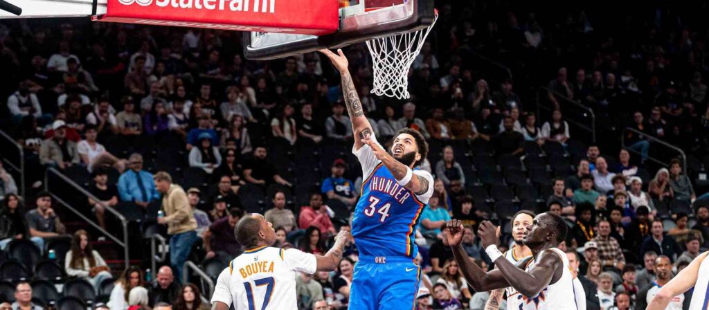 Kenrich Williams lays the ball in Phoenix Suns' basket