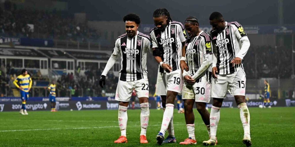 Juventus players celebrate after scoring against Parma