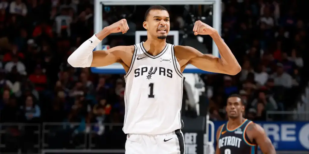 Victor Wembanyama flexing muscles