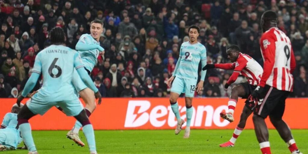 Sunderland player shooting towards Burnley's goal