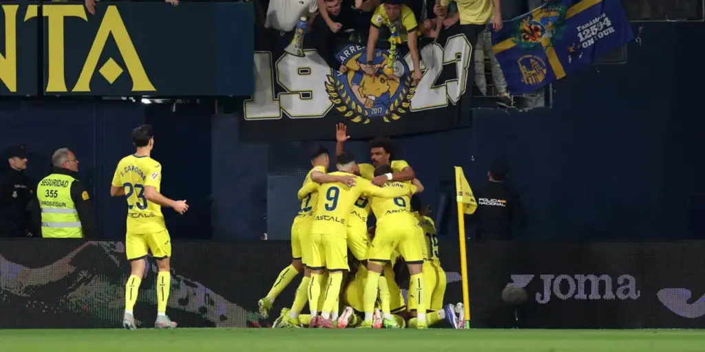 Villarreal players celebrate after scoring against Valencia