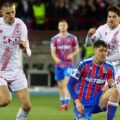 Crystal Palace player surrounded by Zrinjski Mostar opponents