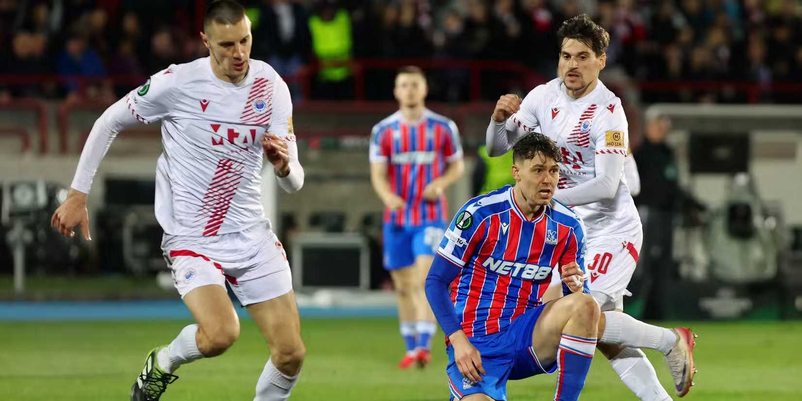 Crystal Palace player surrounded by Zrinjski Mostar opponents