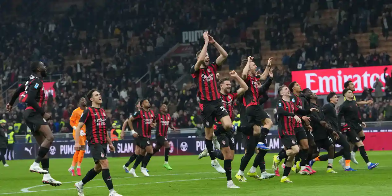 Milan players celebrate after their 1-0 win over Inter