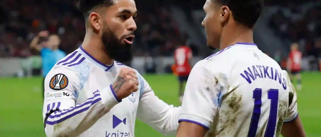 Ollie Watkins celebrates with a teammate after scoring against Lille