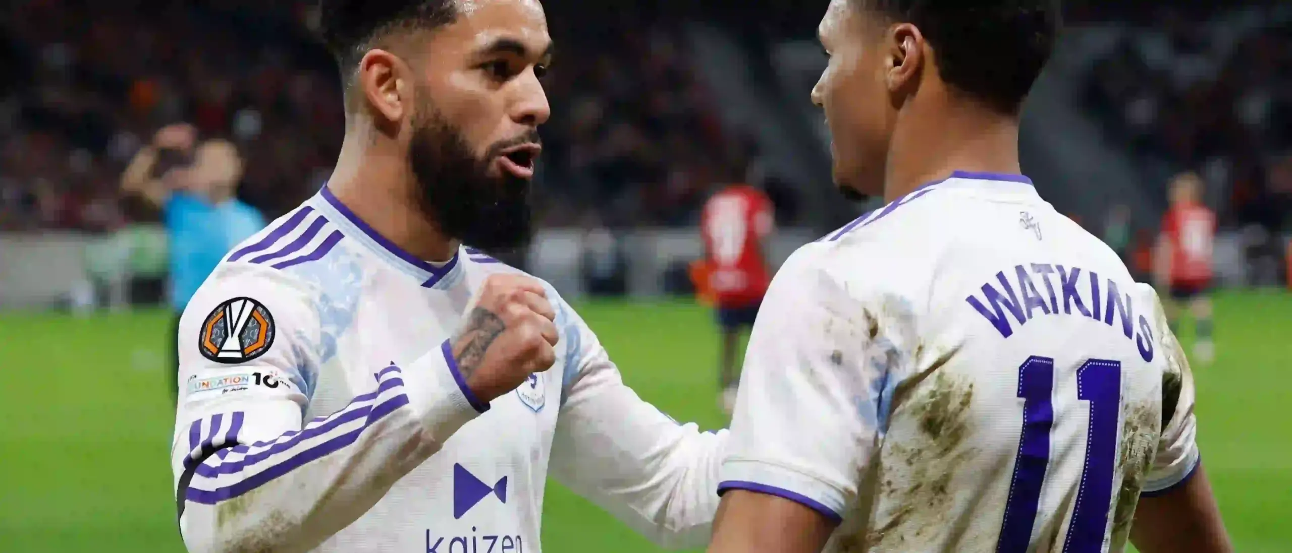 Ollie Watkins celebrates with a teammate after scoring against Lille
