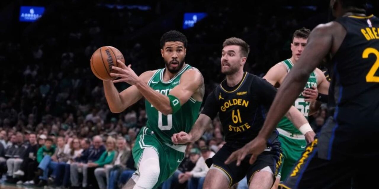 Jayson Tatum attacking Golden State Warriors' basket