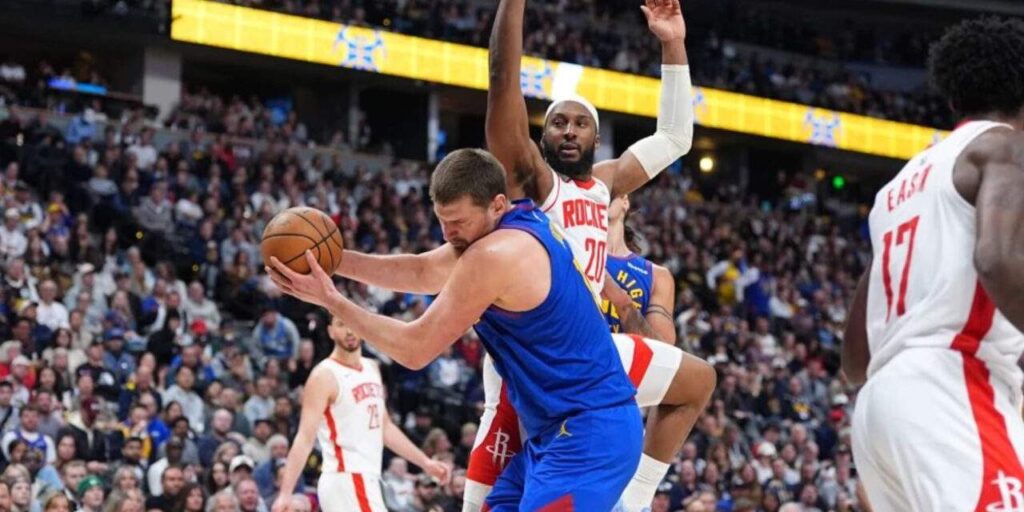 Nikola Jokic grabbing a rebound