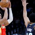 Jalen Johnson shooting over Tobias Harris