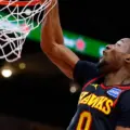 Jonathan Kuminga dunking the ball