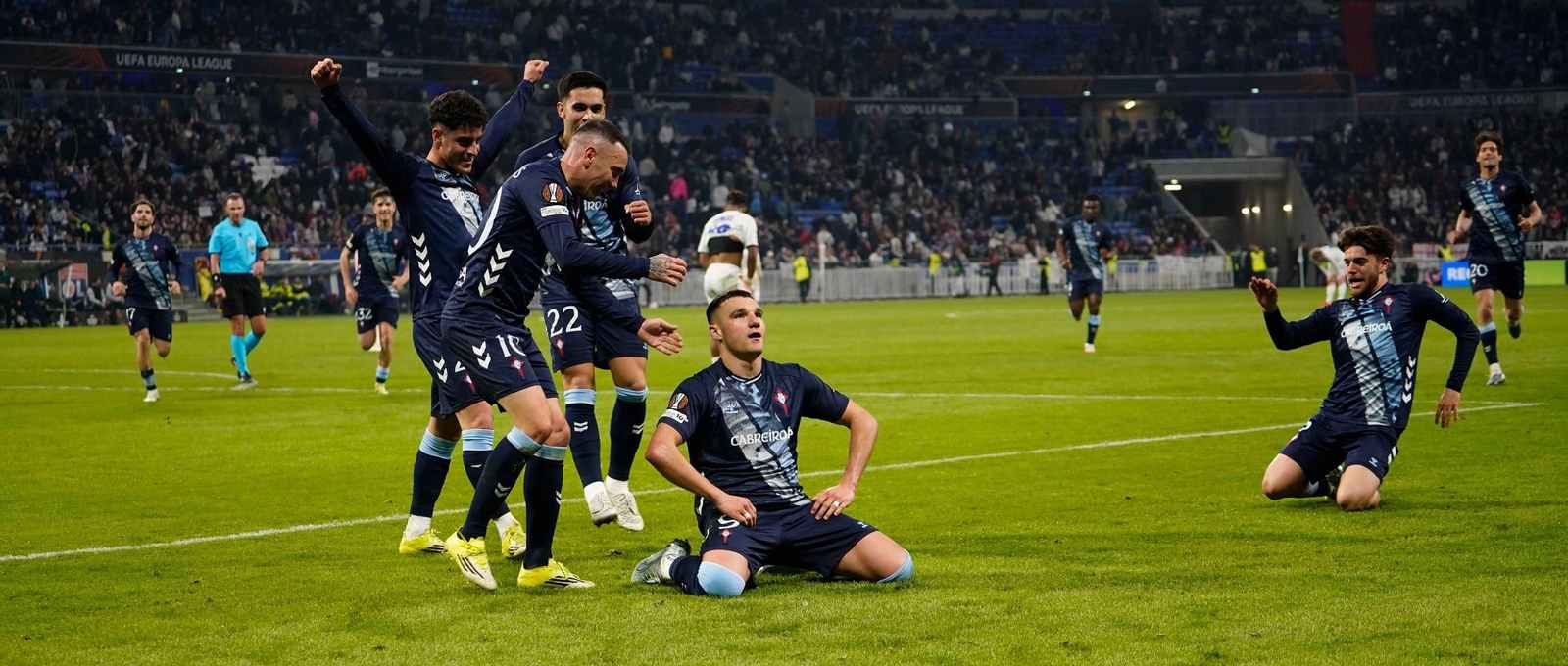 Celta players celebrate after scoring against Lyon