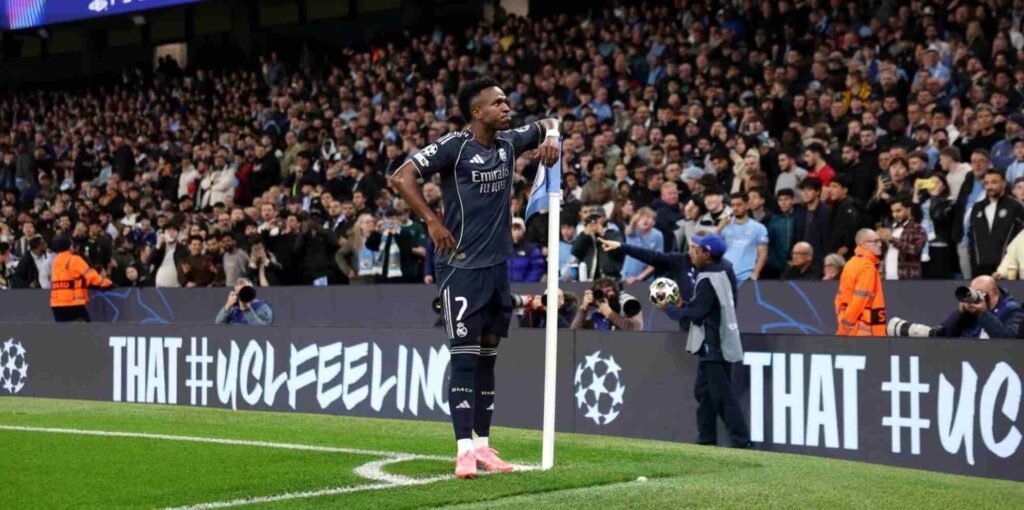 Vinicius Junior celebrates after scoring a penalty against Manchester City