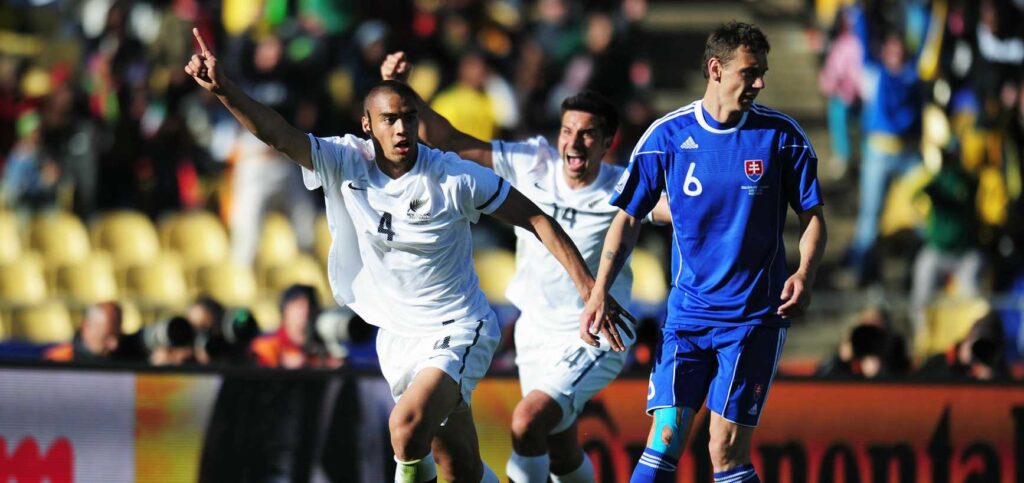 New Zealand players celebrate after scoring a goal