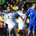 New Zealand players celebrate after scoring a goal