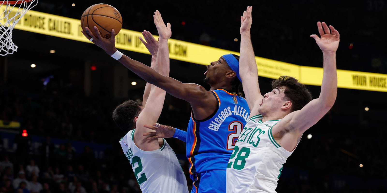 Shai Gilgeous-Alexander attacking Boston's basket through 2 defenders