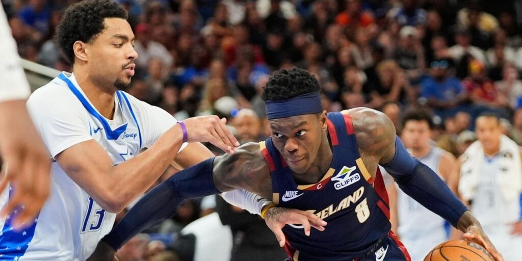 Cleveland Cavaliers guard Dennis Schroder guarded by Orlando Magic player