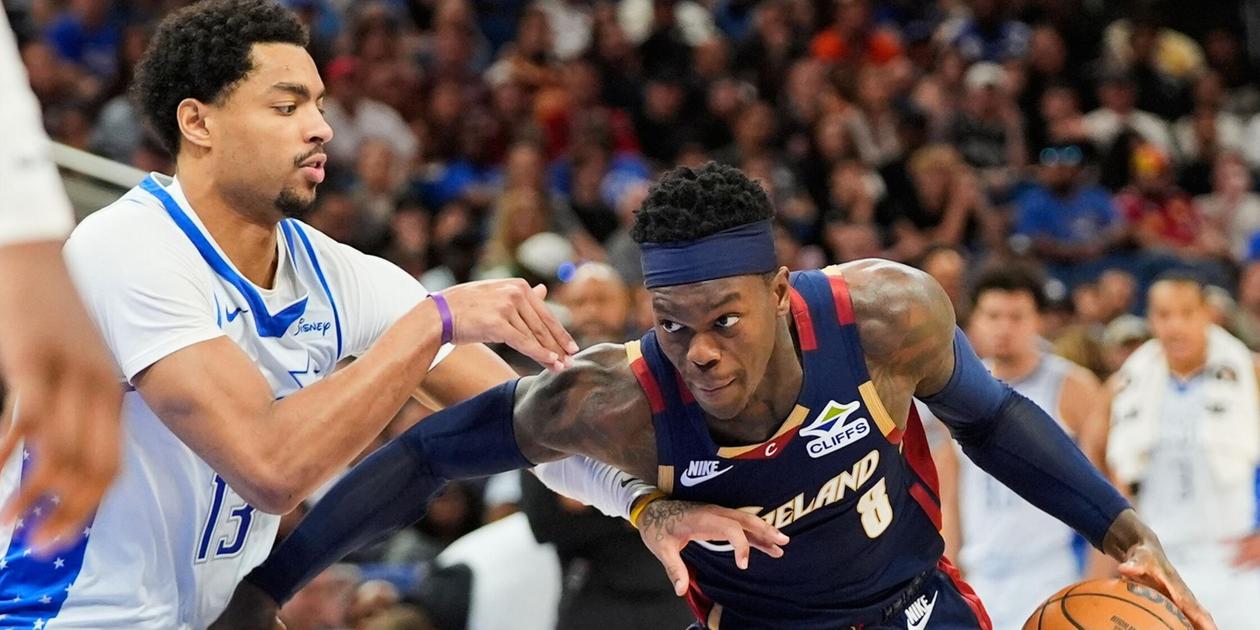 Cleveland Cavaliers guard Dennis Schroder guarded by Orlando Magic player