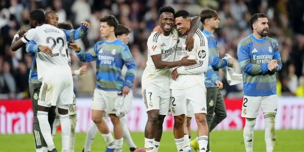 Real Madrid players celebrate after defeating Atletico Madrid
