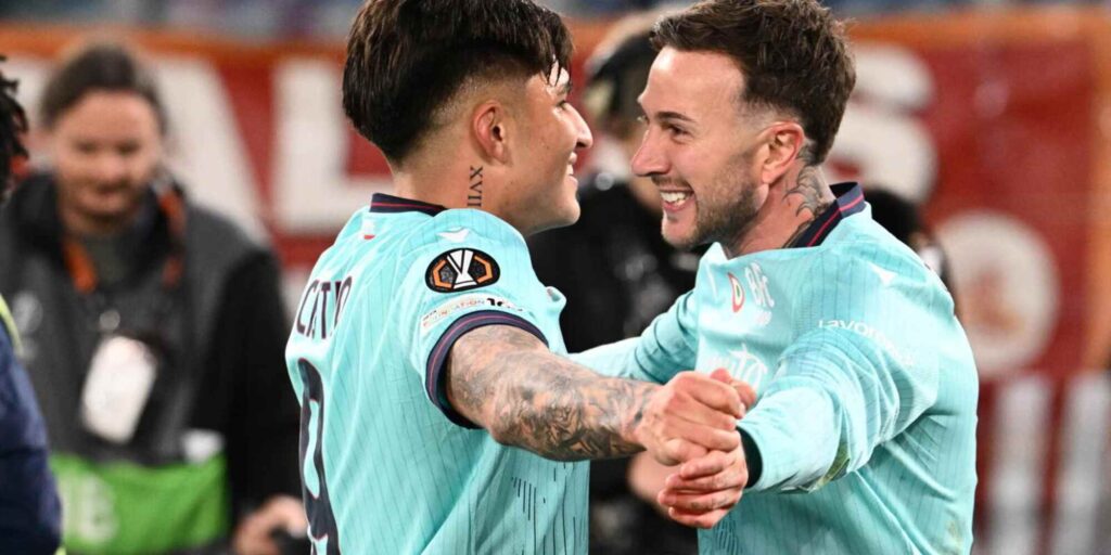 Bologna players celebrate after scoring against Roma
