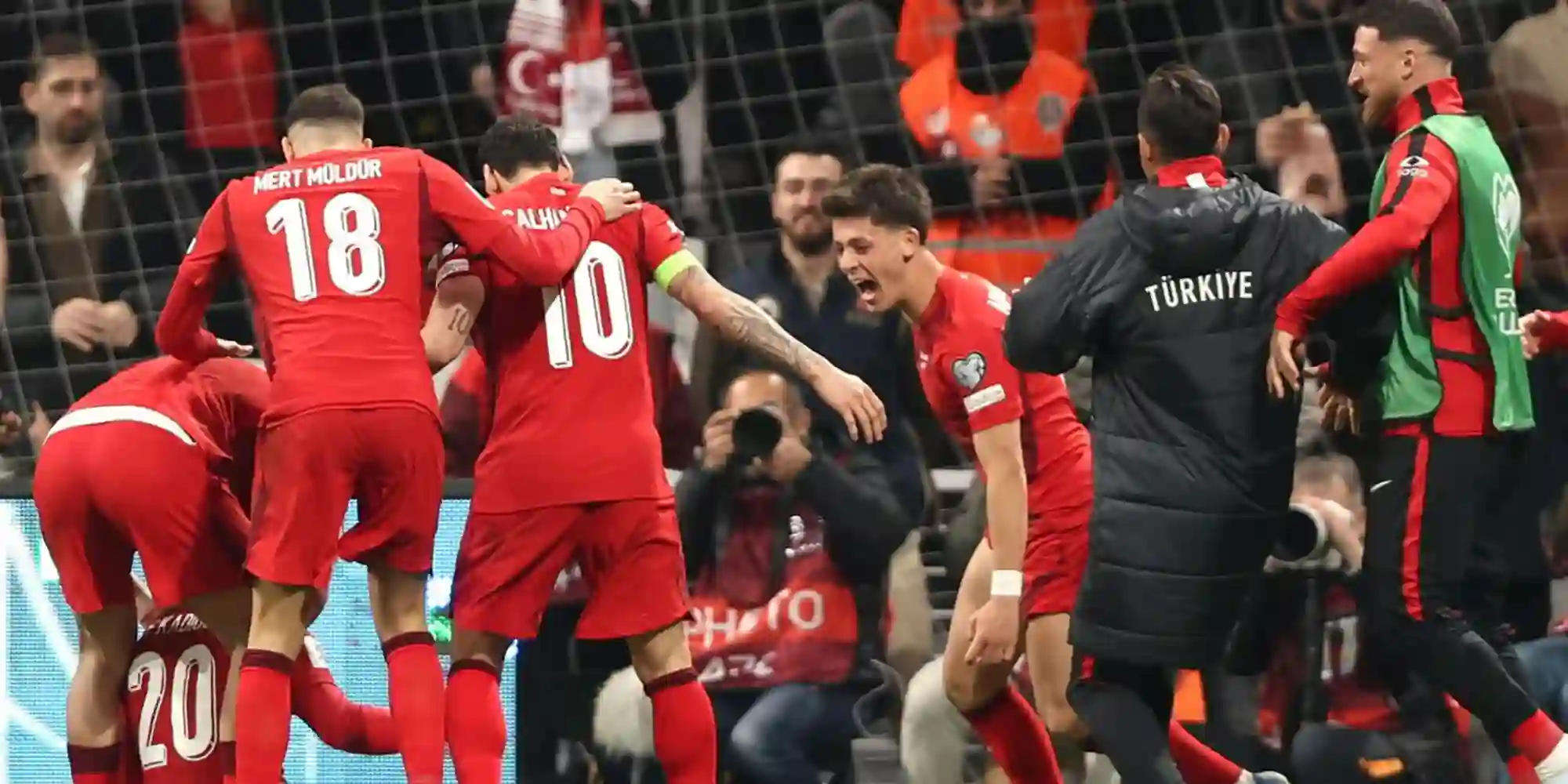 Turkiye players celebrate after scoring against Romania