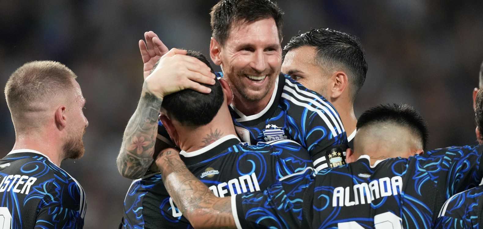 Argentina players celebrate after scoring against Zambia in a friendly match