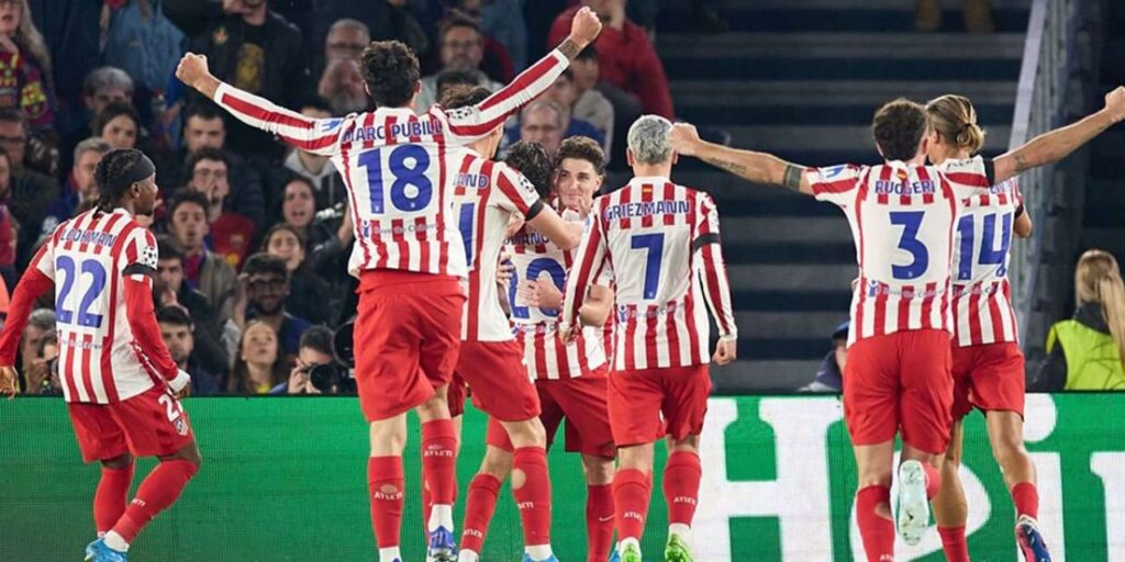 Atletico Madrid players celebrate after scoring against Barcelona