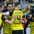 Borussia Dortmund players congratulate one another after scoring against Freiburg