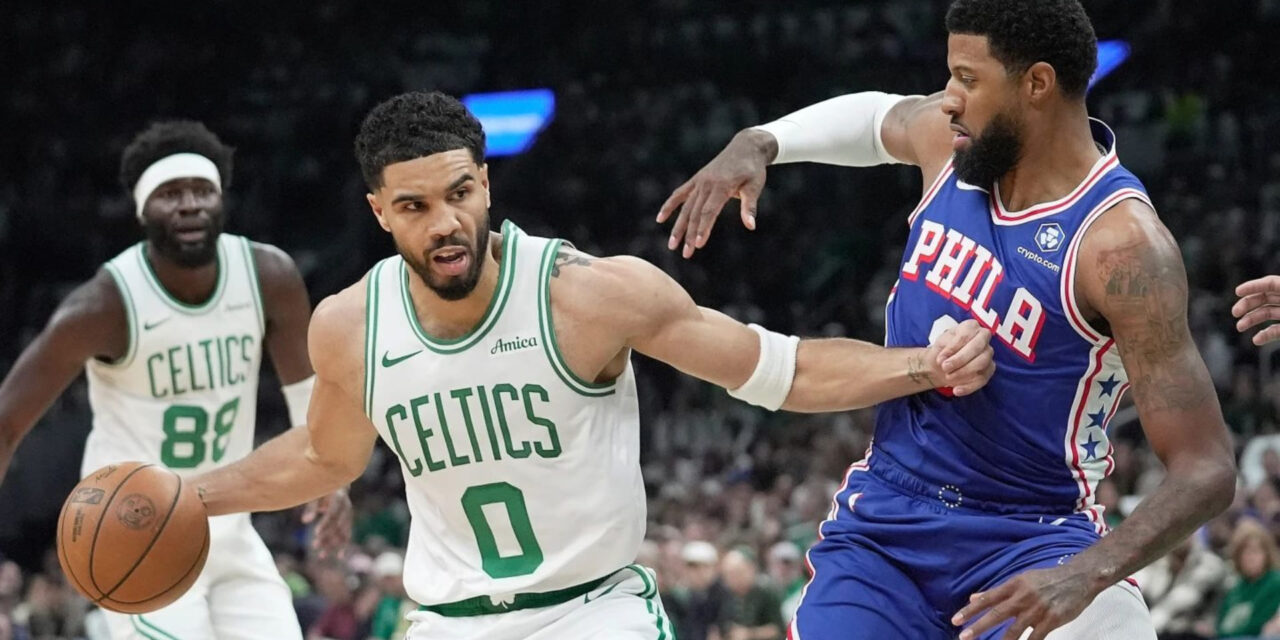 Jason Tatum guarded by Paul George