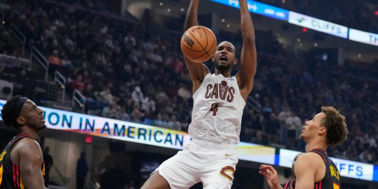 Evan Mobley dunks in Atlanta Hawks' basket