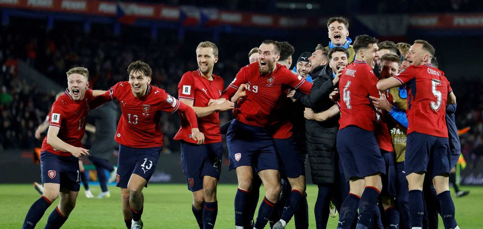 Czech players celebrate after defeating Denmark on penalties