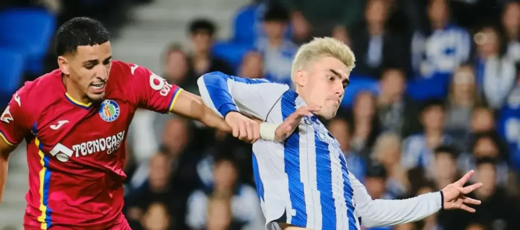 Getafe and Real Sociedad players in a battle for the ball