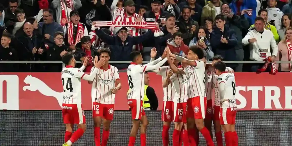 Girona players celebrate after opening the score against Villarreal